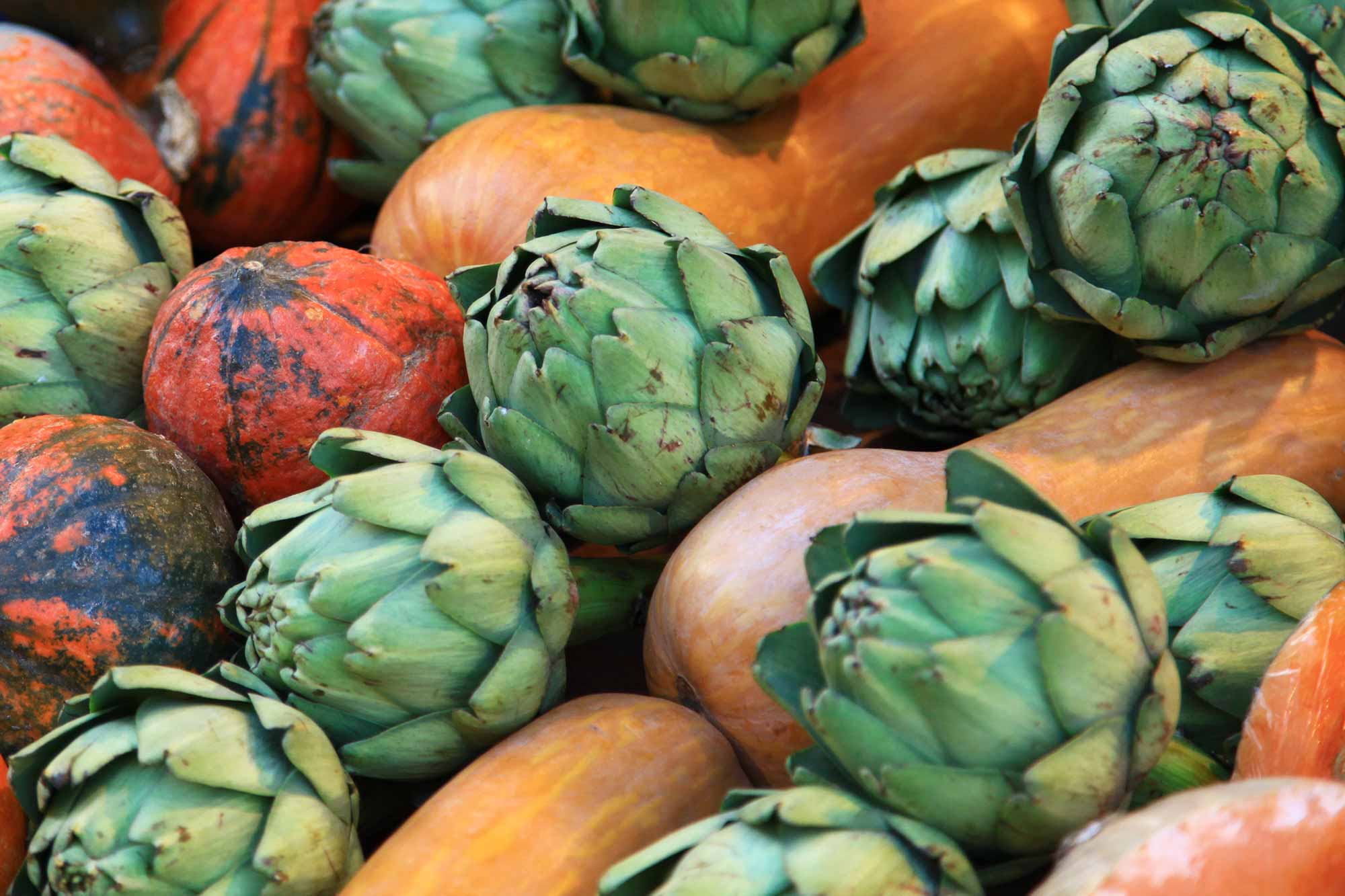 Fresh pumpkins and artichokes at Naschmarkt in Vienna, Austria. © Ulli Maier & Nisa Maier