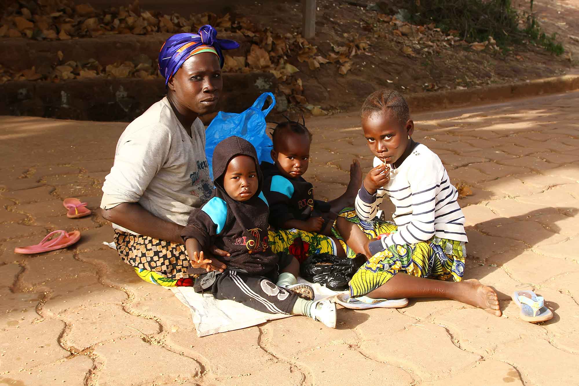 family-sitting-in-streets-of-bobodioulasso-burkina-faso