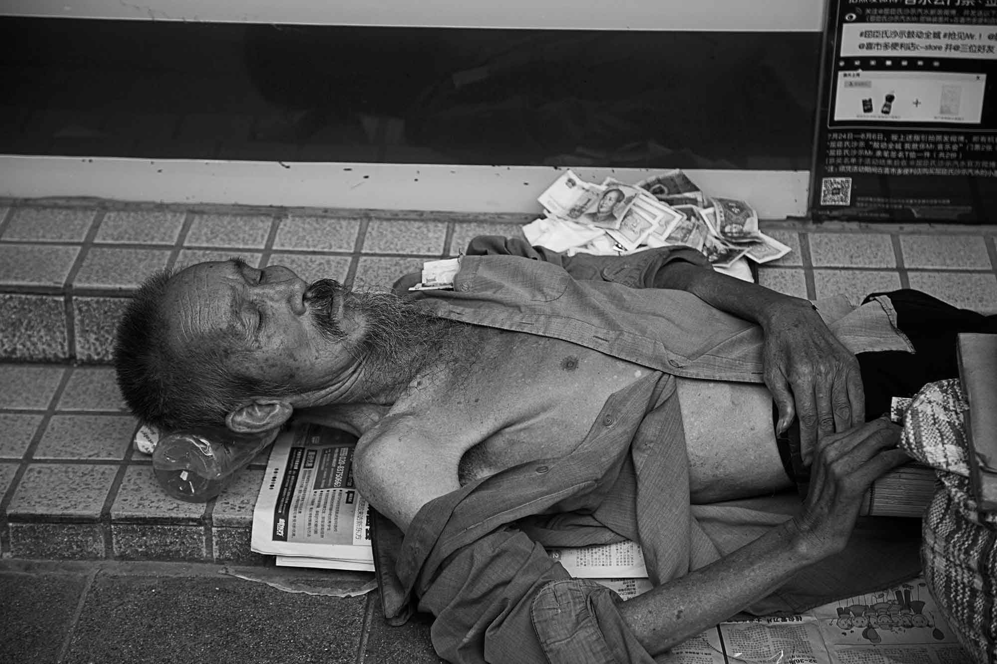 homeless-man-streets-guangzhou-china