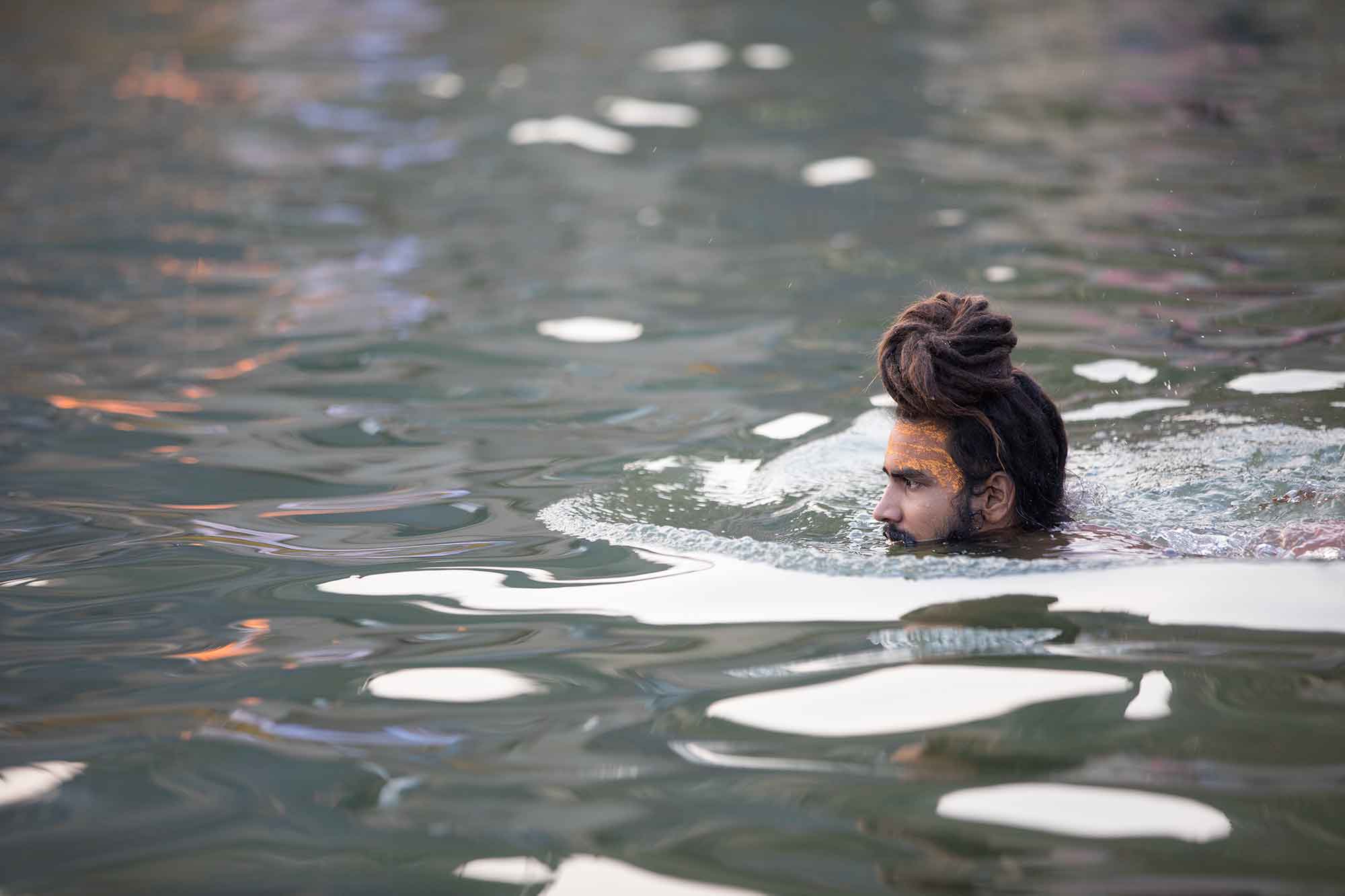 swimming-sadhu-ganges-varanasi-india